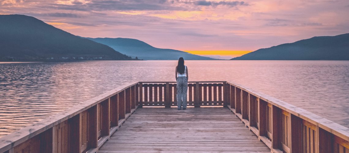wooden-pier-against-mountains-and-sunset-sky-2690807